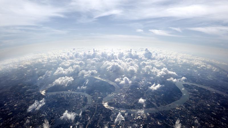 Aerial view of a city over clouds