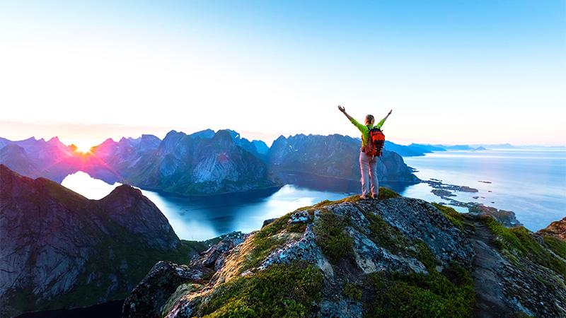 Arms raised on a mountain